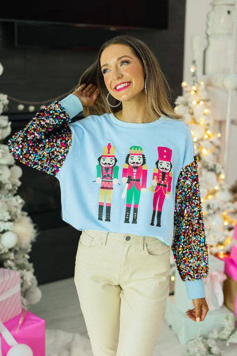 Nutcrackers on Blue Top with Sequin Sleeves